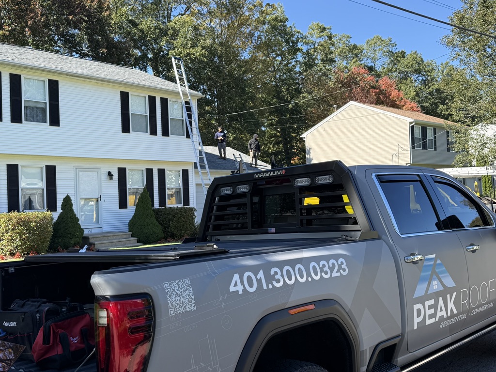 Peak Roofing truck at residential jobsite