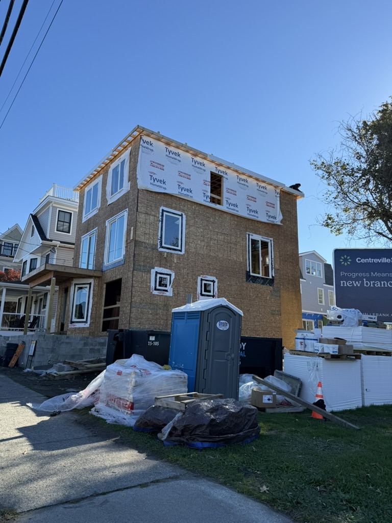 Building under renovation with Tyvek wrap and new windows