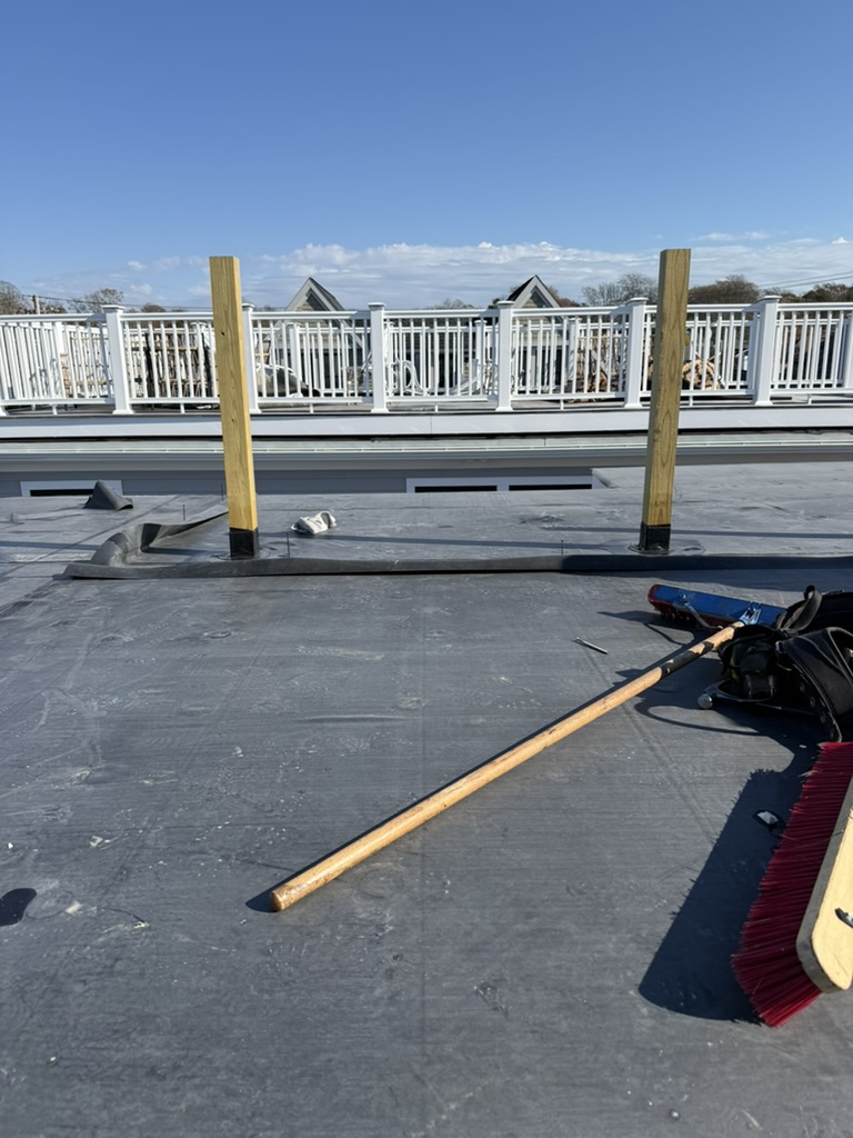 Finished EPDM roof surface with sealed deck posts